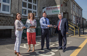 Handover of donated laptops at Gowerton School.