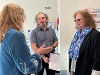 Julie Morgan, Deputy Minister for Social Services, talks to Welshpool CiW Primary School’s outgoing Headteacher Justine Baldwin and Cllr Peter Roberts, Powys County Council’s Cabinet Member for a Learning Powys